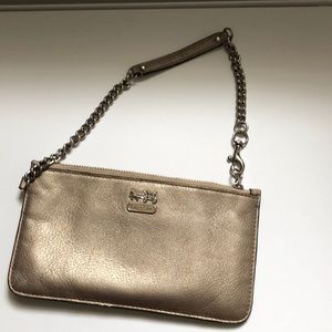 Coach wristlet. Metallic. Good used condition.
